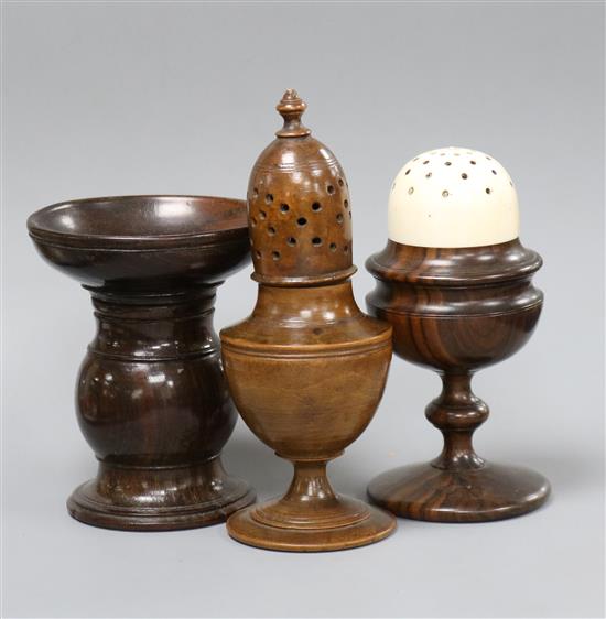 An early 19th century lignum vitae and ivory castor, 11cm, a treen castor, 13.5cm and a pounce pot, 9.5cm